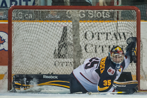 April 13th, 2012, Ottawa : Barrie Colts goalie Mathias Niederberger ((35) streches to make a save in the second period against the Ottawa 67s at the J. Benson Cartage arena. The 67s won over the Colts by a score of 2.1.