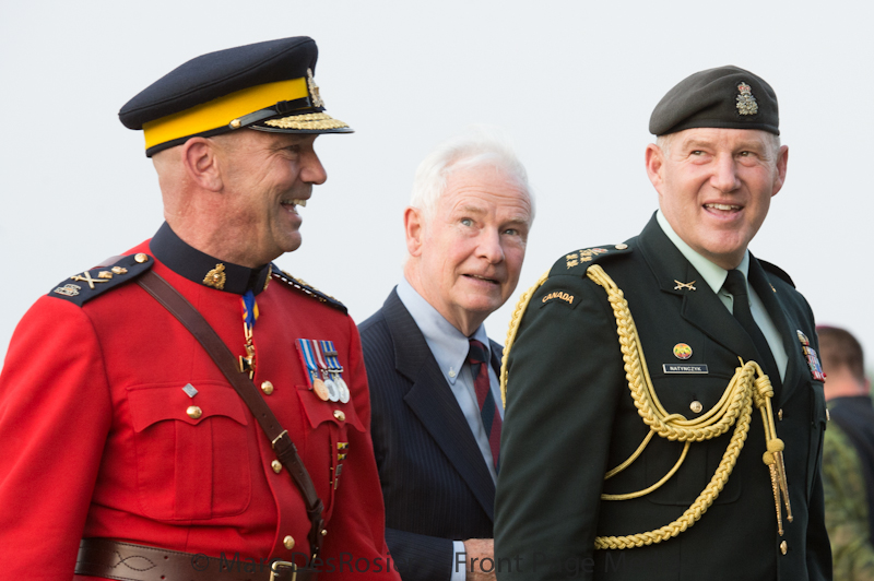 Governor General. and Commander in Chief of the Canadian Military David Johnston celebrates his birthday with , RCMP Commissioner Bob Paulson, Chief of Defence staff and Military Commander and Chief of Defense Staff Walter Jonh Natynczyk and members of the public who attended the RCMP Musical Ride Sunset Ceremonies at the Police Training Headquarters in Ottawa, ON, Canada