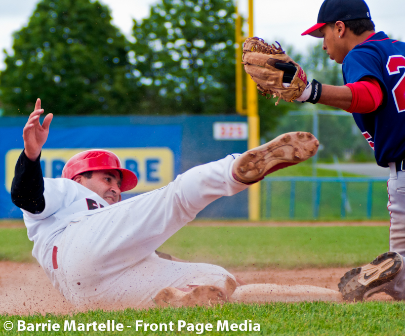 Ottawa Fat Cats Patrick Gangon (7) slides into third base at the Ottawa Stadium on Monday June 4, 2012. The Hamilton Cardinals defeated the Ottawa Fat Cats by a score of 7-6