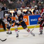 Zack Hall of the Barrie Colts skates past the Ottawa 67s defense
