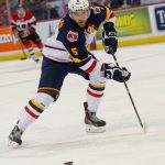 Aaron Ekblad of the Barrie Colts controls the puck